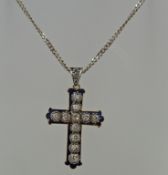 An enamel and diamond cross,