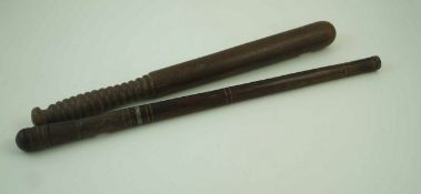 A 20th century wooden truncheon with a turned handle, 44cm long, along with Indian swagger stick,