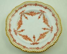 A late 19th century Copeland porcelain plate, decorated in iron red and gilt with flower swags,