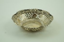 A silver pierced and embossed round dish, Birmingham 1899 by Aidie and Lovekin Ltd,