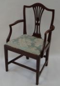 A 19th century mahogany elbow chair with pierced splat,