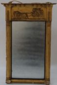 An early 19th century mirror, with plaster moulded cornice with a chariot pulled by three lions,