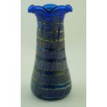 A flared art glass vase with trailed decoration and horizontal bands,