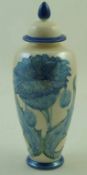 A Moorland Chelsea works vase and cover, with tubelined poppies on a white pearlescent ground,