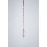 A crucifix pendant, on a figaro link chain, stamped '375', 59cm long, 7.