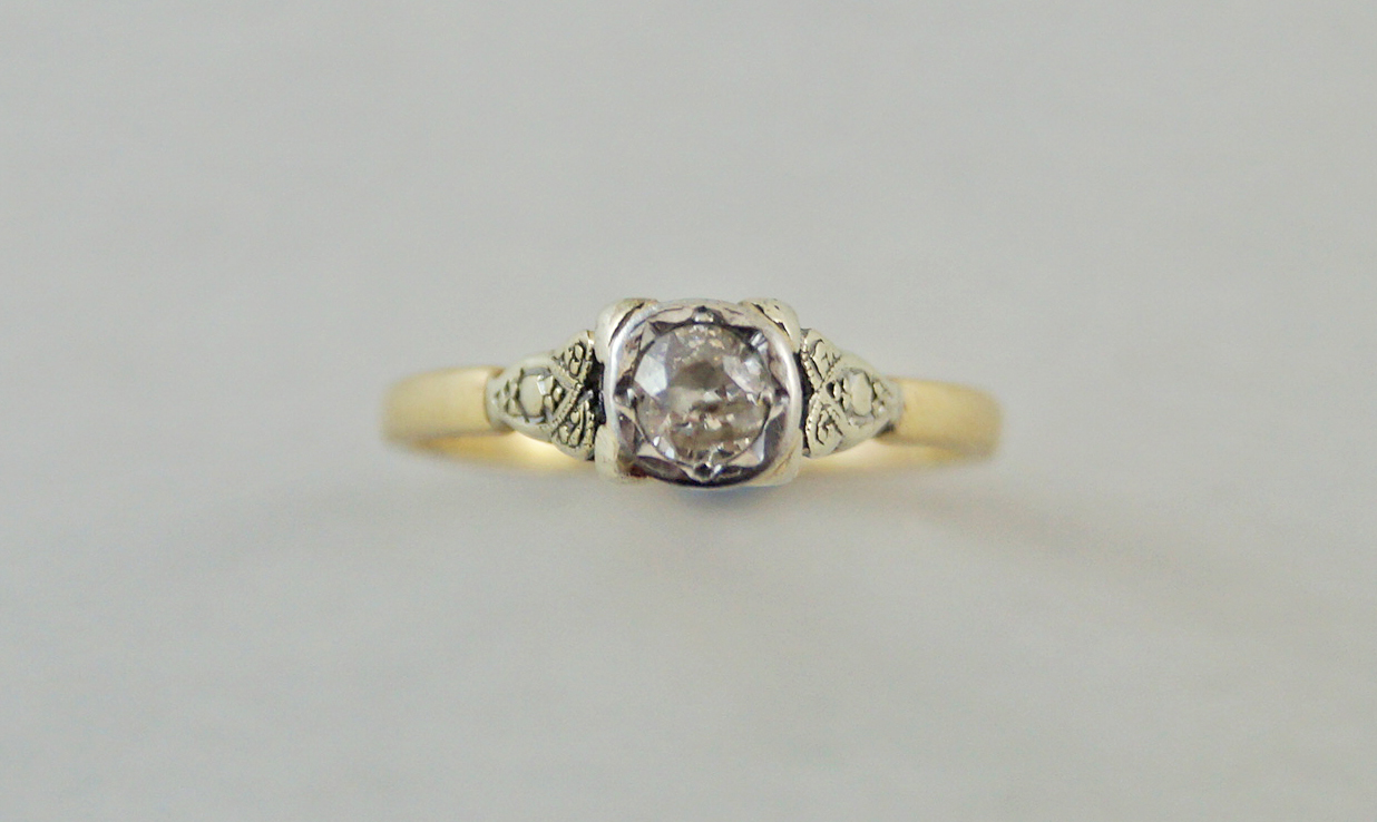 A single stone diamond ring, the illusion set brilliant of approximately 0.