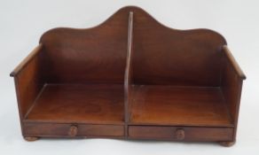 A late Victorian mahogany book caddy with two handles, two drawers and bun feet,