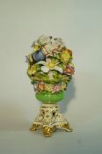 A 19th century Bloor Derby vase of encrusted flowers on a pierced waisted rectangular base on