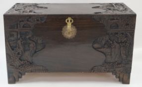 A Chinese carved camphor wood chest, with stained finish, 59.