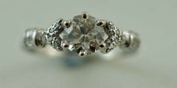 A diamond single stone ring, the white mount unmarked,