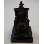 A bronze figure of Fortuna on her throne, and black slate plinth,