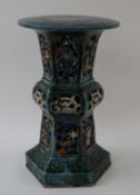 A pottery garden seat with pierced hexagonal flared base, 52.