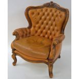 A walnut show frame armchair with leather button back and loose cushion on cabriole legs