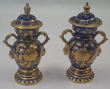 A pair of Masons ironstone vases and covers, each decorated in gilt on a blue ground, circa 1815,