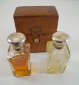 A pair of silver topped scent bottles, Birmingham 1929,