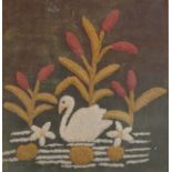 An Edwardian needlework picture with tufted needlework swan swimming within reeds, 39cm x 37.