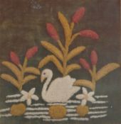 An Edwardian needlework picture with tufted needlework swan swimming within reeds, 39cm x 37.