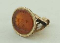A Victorian gold fob seal with a carnelian intaglio of a pointer,