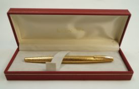 A Sheaffer Triumph Imperial fountain pen, white spot with gold bark finish,