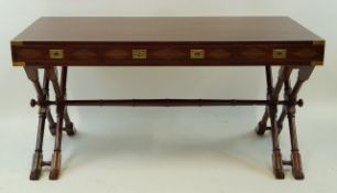A rosewood brass inlaid pedestal desk with three frieze drawers with campaign style brass handles,