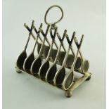 A silver plated tennis racket toast rack,