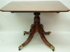 A 19th century mahogany rectangular snap top supper table, on a turned pillar,