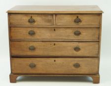 A George III mahogany chest of two short and three long drawers on bracket feet, 87cm high, 110.
