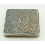 A silver compact, unmarked, decorated with abstract figures, 6.5cm x 6.