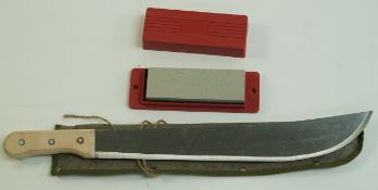 A modern military machete in canvas holder,