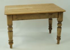 A 19th century pine kitchen table with one frieze drawer and turned handles on turned legs, 74.