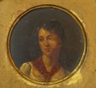 A 19th century papier mache round snuff box cover painted with a portrait of a lady within a gilded