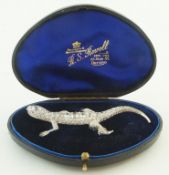 A diamond set lizard brooch,
