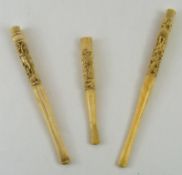 Three late 19th century carved ivory cheroot holders,
