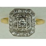 A diamond cluster plaque ring, of three tier design, finger size M, 2.