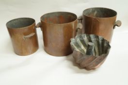 A set of three copper two handled stock pots, 20cm diameter to 15.