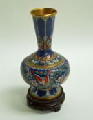 A cloisonné vase of bulbous form with long flared neck and flared foot,