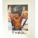 A signed printed photograph of boxer Mike Tyson,