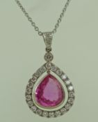 A pink sapphire and diamond cluster pendant,