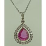 A pink sapphire and diamond cluster pendant,