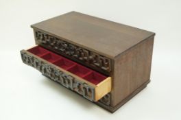 A mahogany three drawer jewellery box with applied Chinese style blind fretwork on a plinth base,