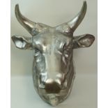 A cast model of a bulls head, with wall hanging plate to the rear, approximately 64cm high,