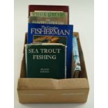 A small collection of fishing related books including Sea Trout Fishing,