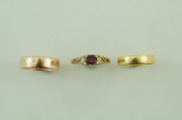 An 18 carat gold wedding ring, 1.