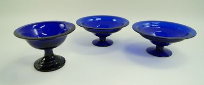 A pair of Bristol blue style bowls each with a flared foot, 26.
