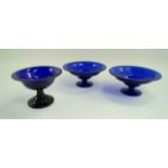 A pair of Bristol blue style bowls each with a flared foot, 26.