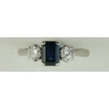 A sapphire and diamond three stone ring, the white mount stamped '18ct Plat',