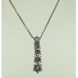 A five stone diamond pendant, the graduated brilliant cuts totalling approximately 1.