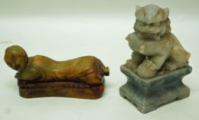 A carved Chinese soapstone figure of a dog of Fo on a waisted rectangular pedestal, 8cm high,