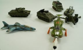 A small collection of Dinky toys, including a U.F.