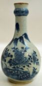 A late 19th century Chinese export bottle shaped vase painted in underglaze blue with a flowering